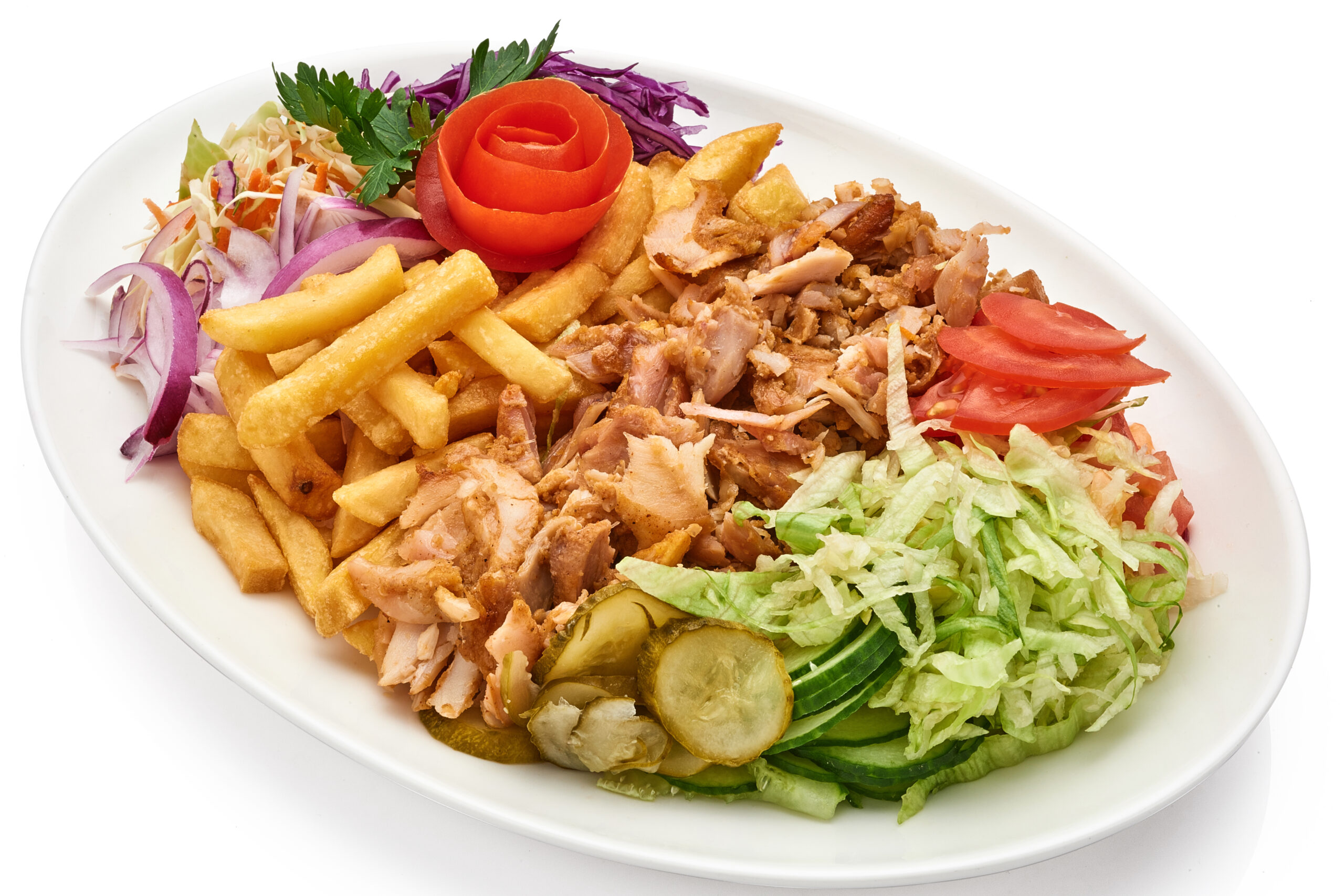 Doner kebab on a plate with french fries and salad